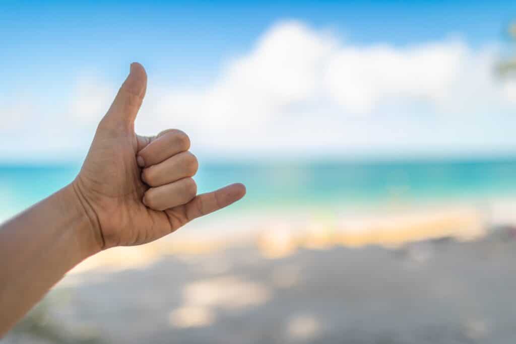 Shaka, hang loose, hand sign on a tropical Hawaii beachhateii hawiia hawaii. hawaiii hawiaii hwaii hawaai hawall hawii hawwai hawwaii hawwii hiwaii haiwaii hawia hawwi 2116434017