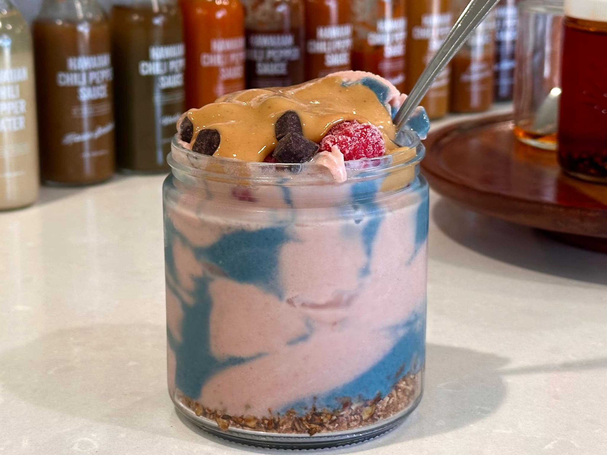 Ube-poi smoothie bowl with chocolate, peanut butter, coconut yogurt and raspberries at Kauai Juice Co. Photo by Sarah Burchard.