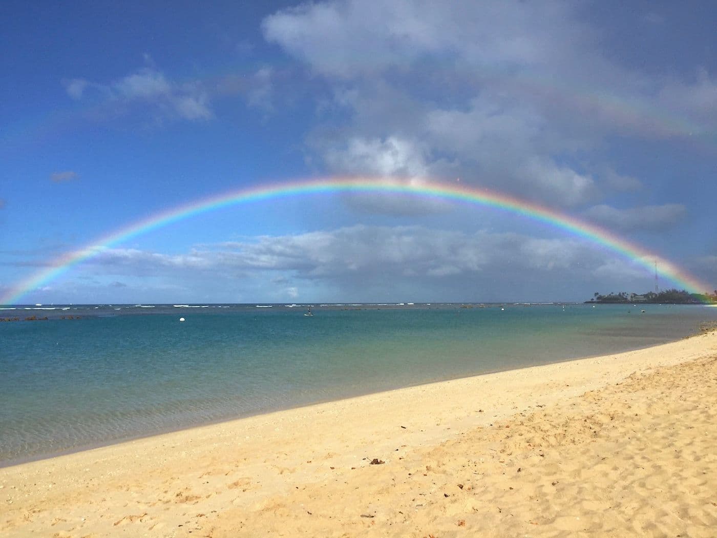 A double rainbow over the ocean at ala moana beach in honolulu oahu.