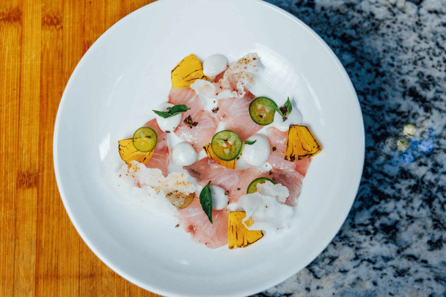 Citrus-cured kampachi crudo at Aurum Maui. Photo by Sebastian Sayegh at Sayegh Visuals.