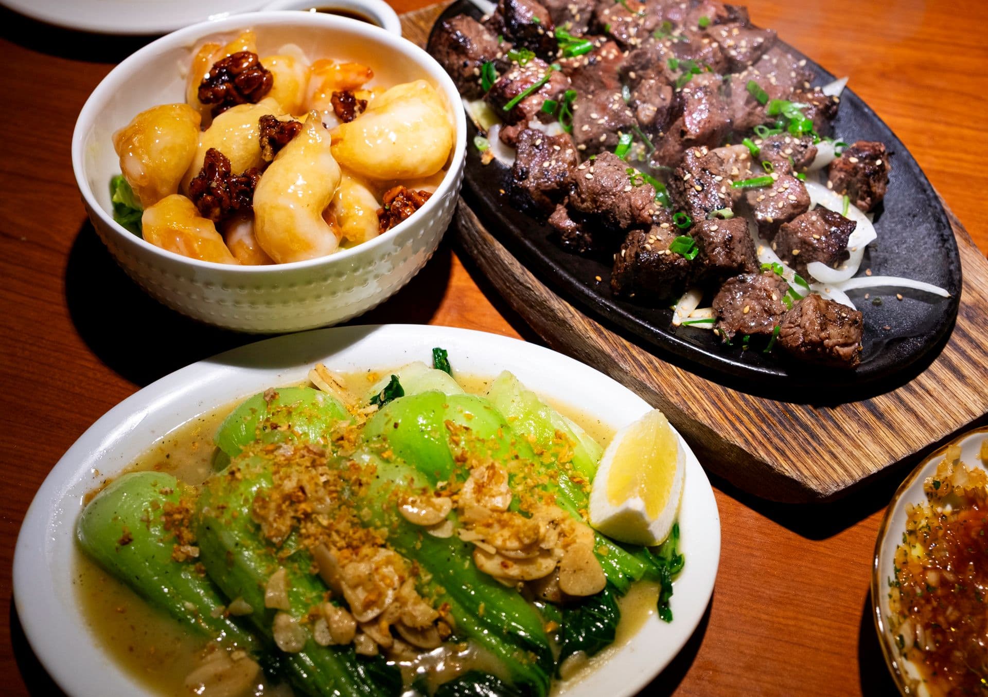 Sizzling steak bites and garlic bok choy at Tiffany's Restaurant & Bar. Photo by Sarah Burchard.