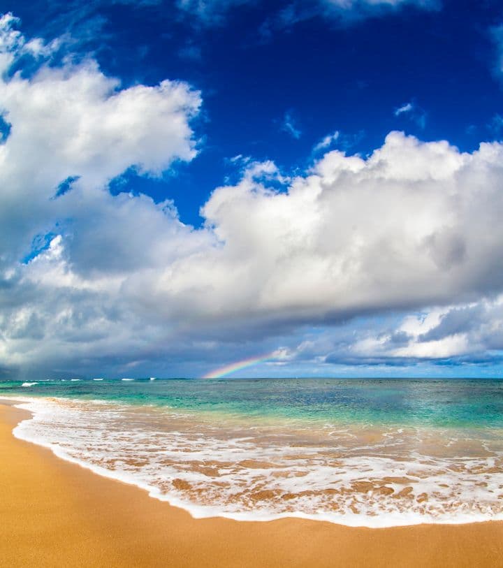 A rainbow off of Sunset Beach on Oahu's North Shore.