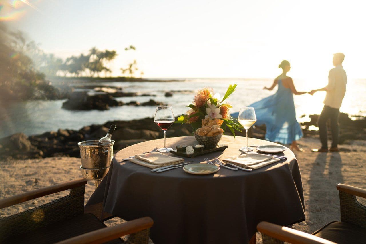A couple dining on the beach