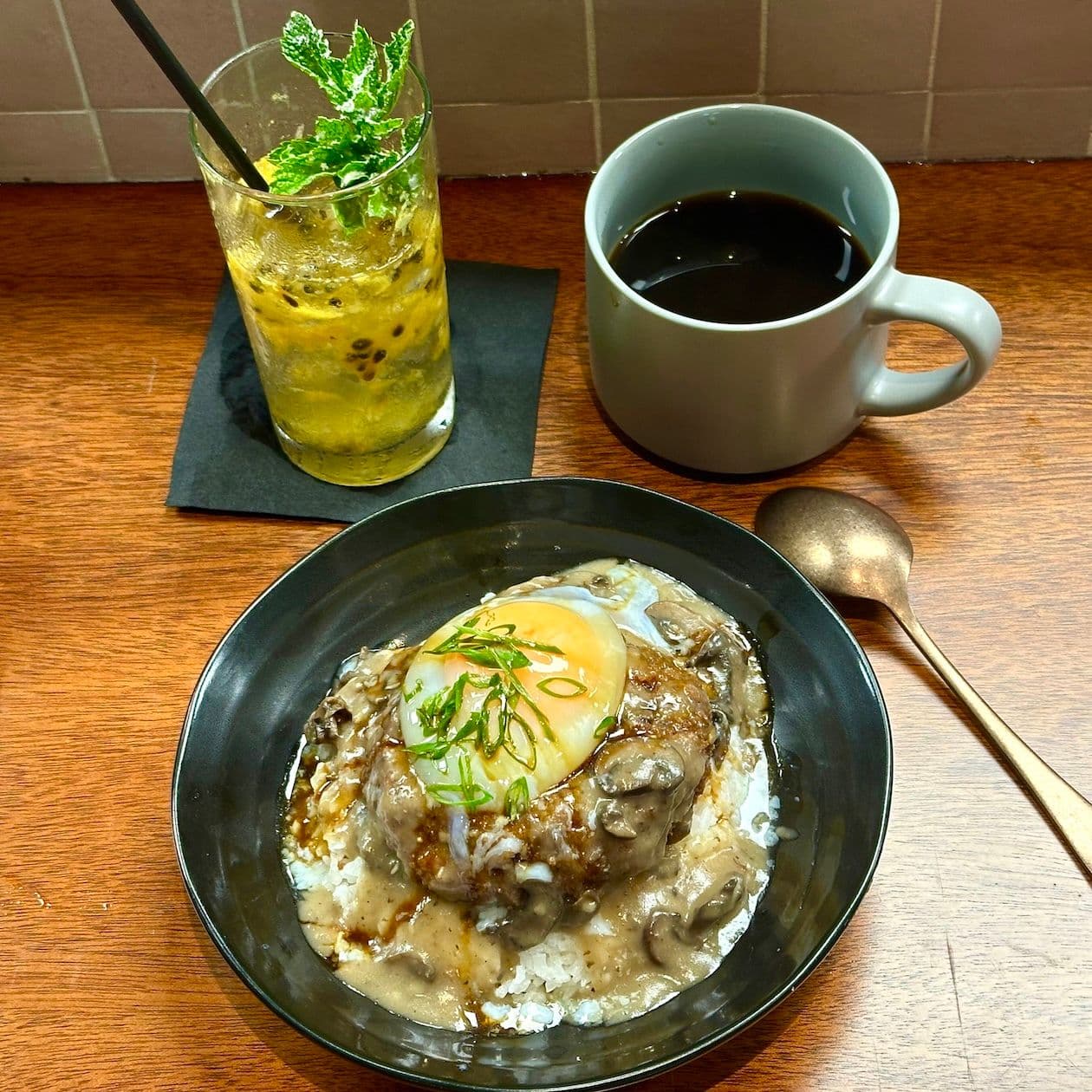 hamburger steak over rice, lilikoi soda and cup of coffee
