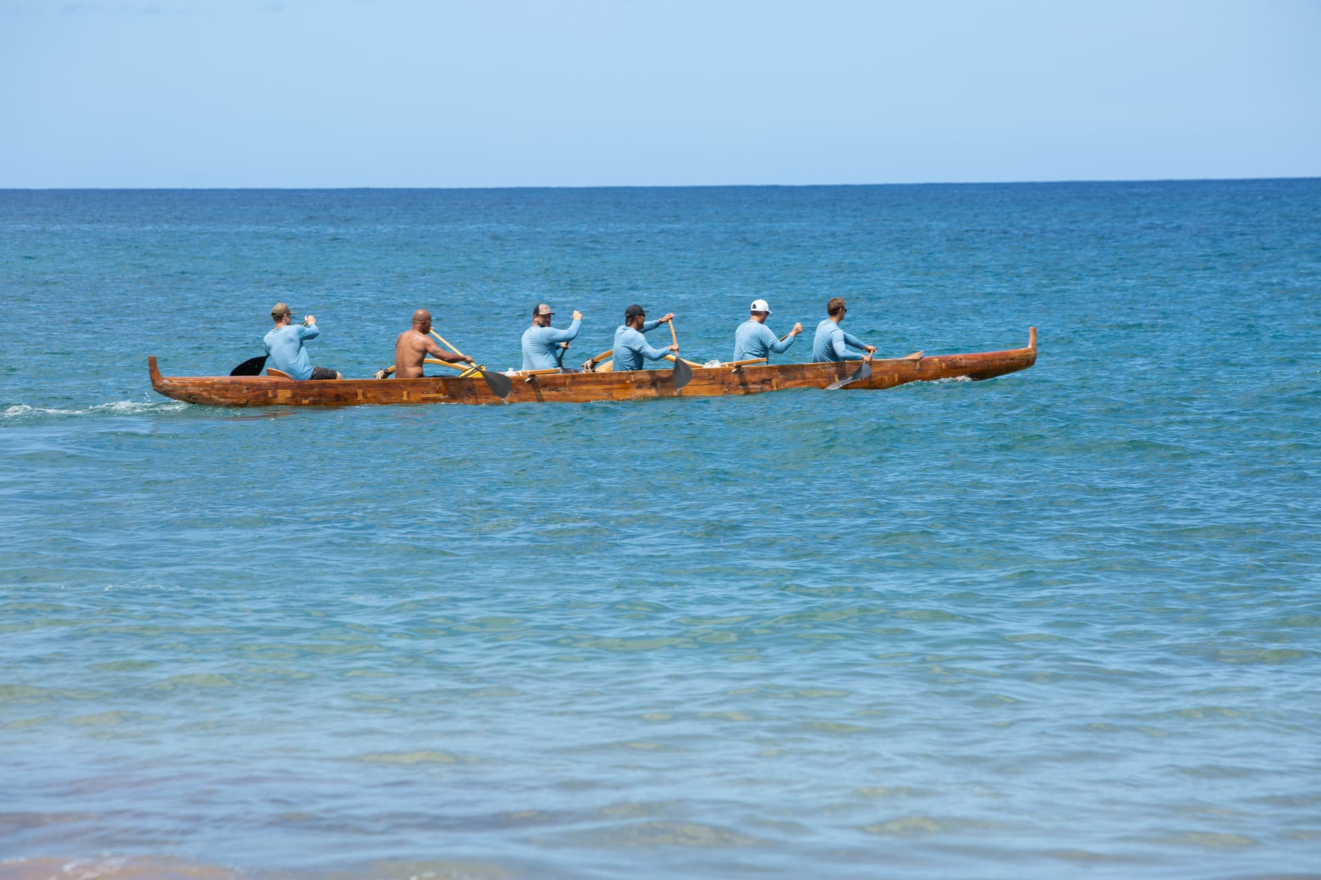 canoe paddling in ocean