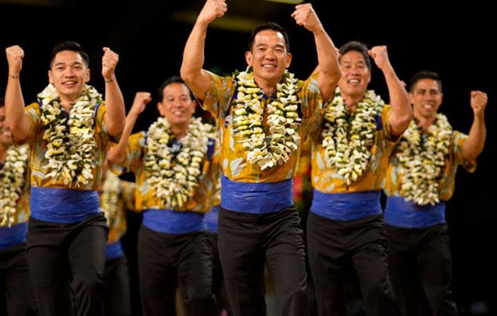 The kane from Na Kamalei (Kumu Hula Robert Uluwehi Cazimero; Honolulu, Oahu) dance during the AUANA portion of the Merrie Monarch Festival competition. PHOTO BY DENNIS ODA. APRIL 10, 2015.
