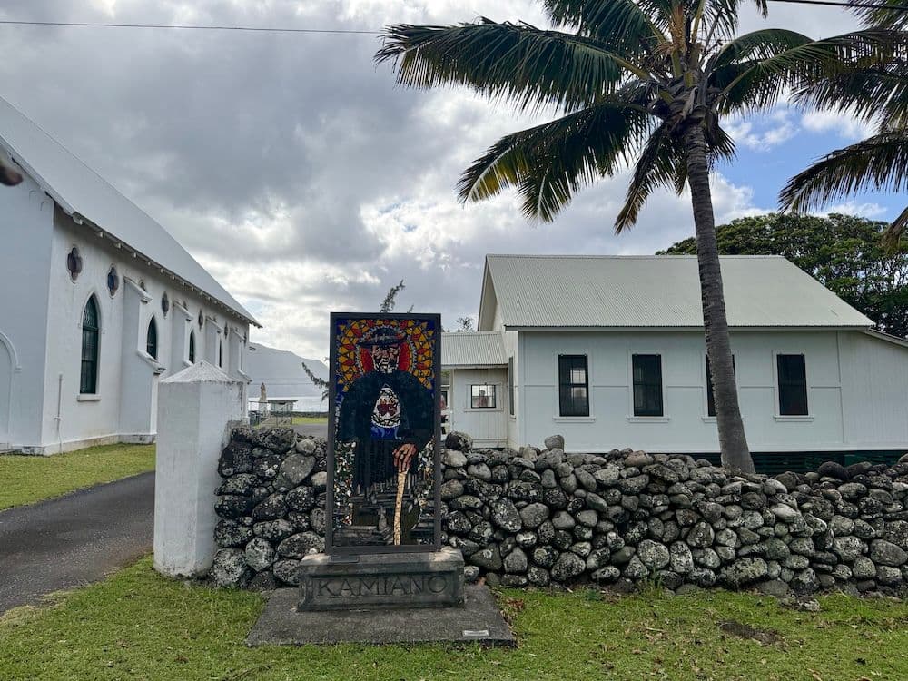 A mosaic of Father Damien de Veuster stands at the entrance of St. Damien Hall. Photo by Natasha Bourlin.