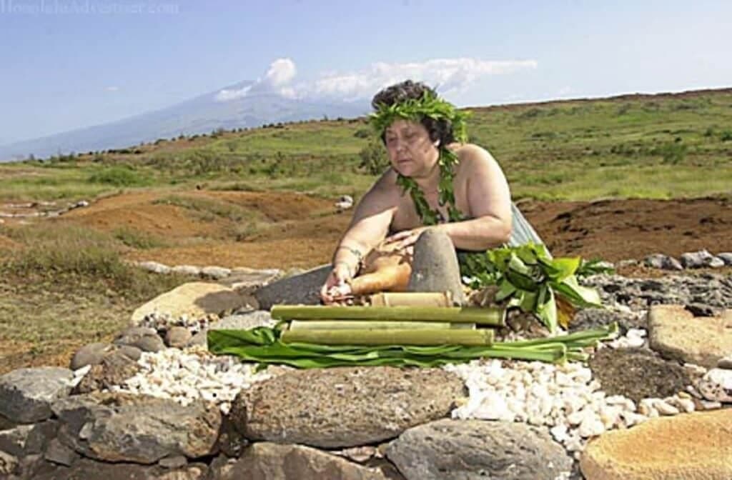 Hawaiian woman sitting on ground