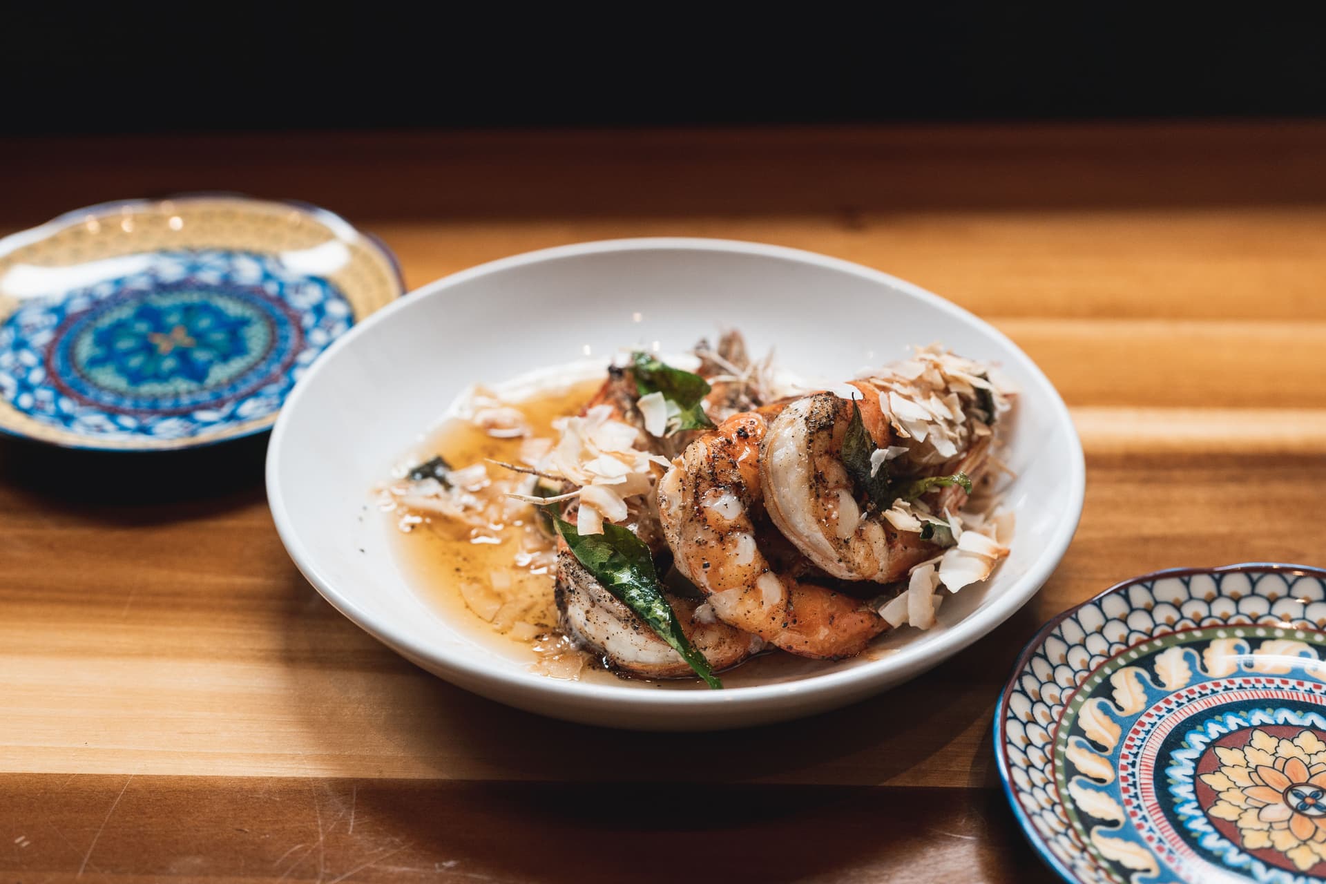 Shrimp dish on a wooden cutting board