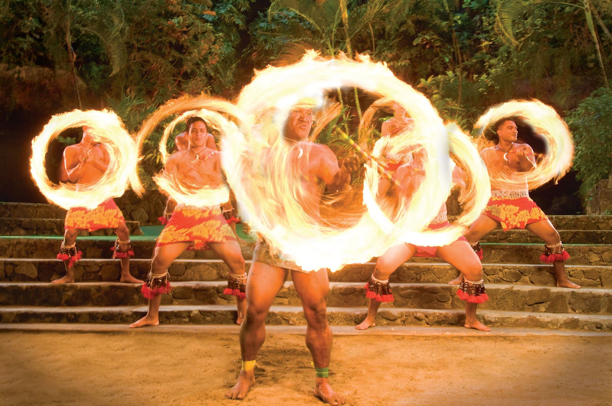 Kap and his group performing fireknife dancing. Courtesy of Polynesian Cultural Center.