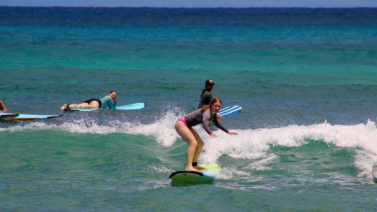 Young girl surfing