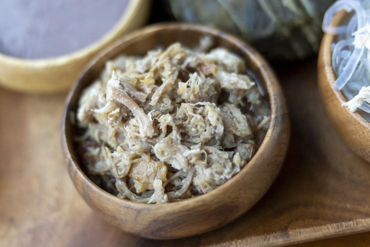 Kālua pig is traditionally cooked slowly in an underground imu. Photo by Marco Garcia.