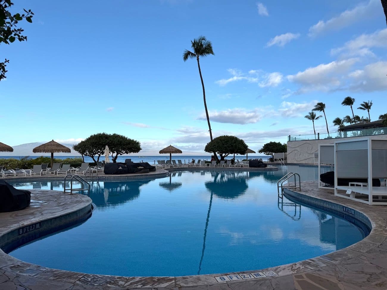 The pool surrounded by palm trees at Hyatt Maui in Hawaii.
