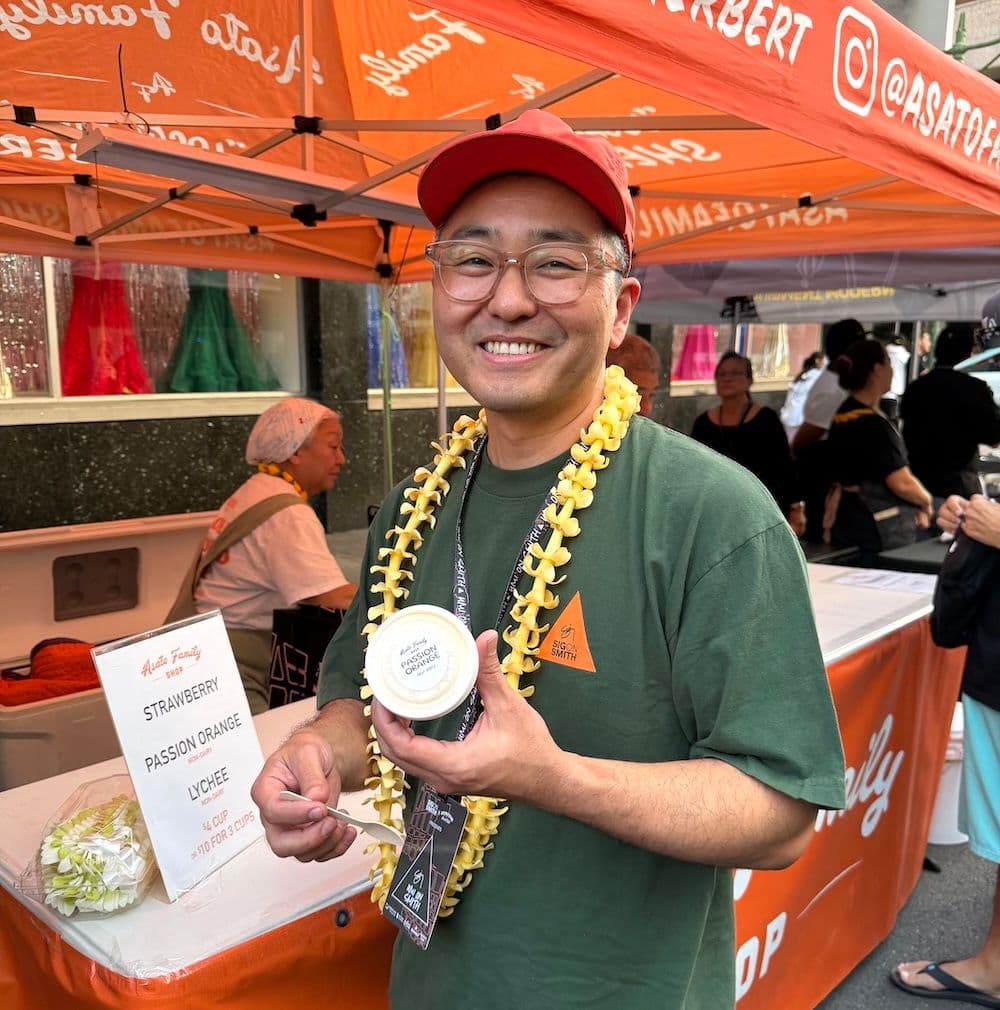 Neale Asato holding a cup of his locally made sherbert at a street fair in Honolulu oahu.