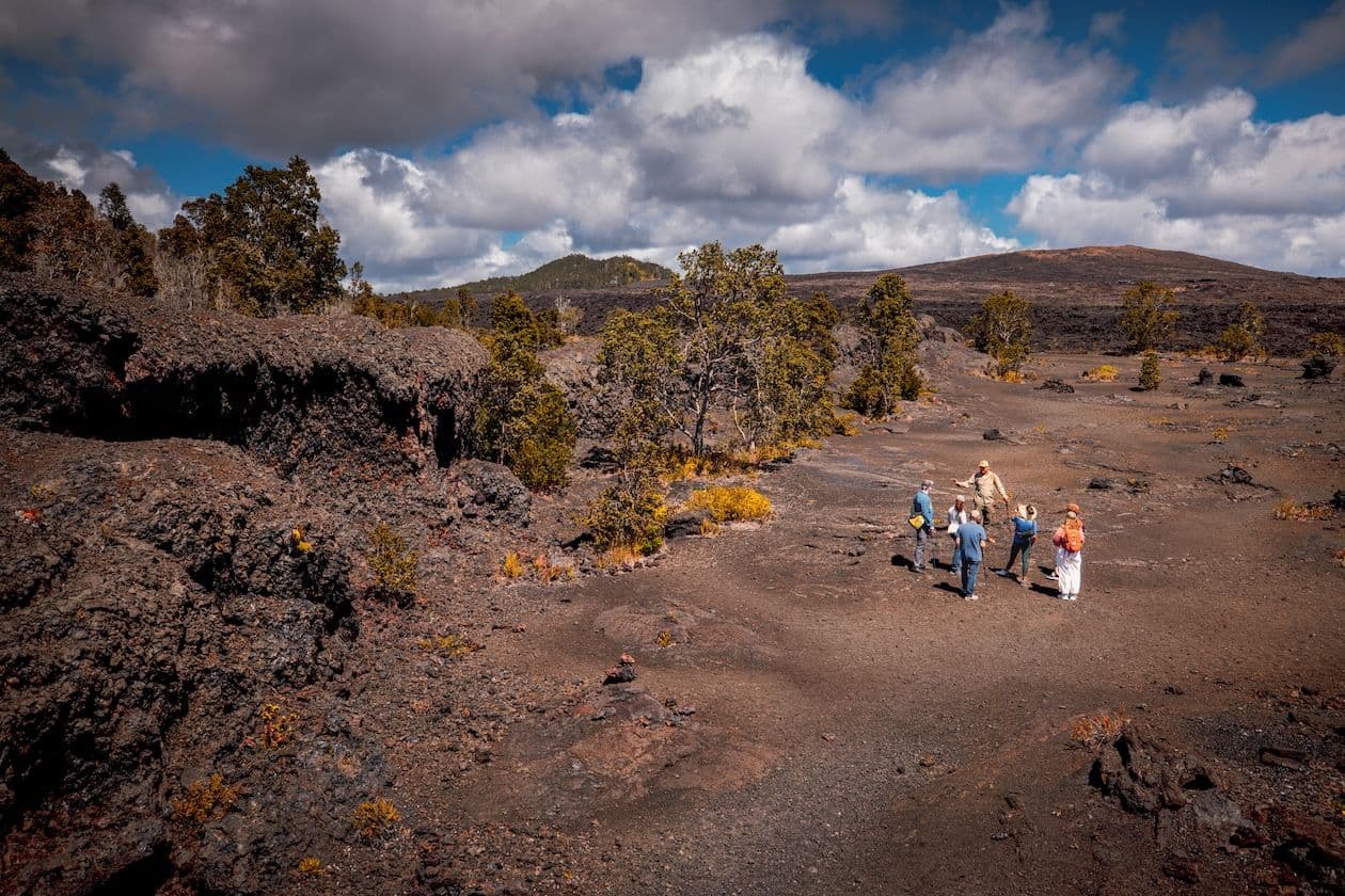 a tour group exploring volcanoes in hawaii