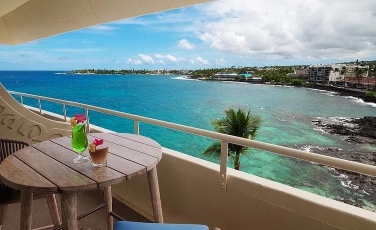 Looking off the patio of a hotel room on to the ocean