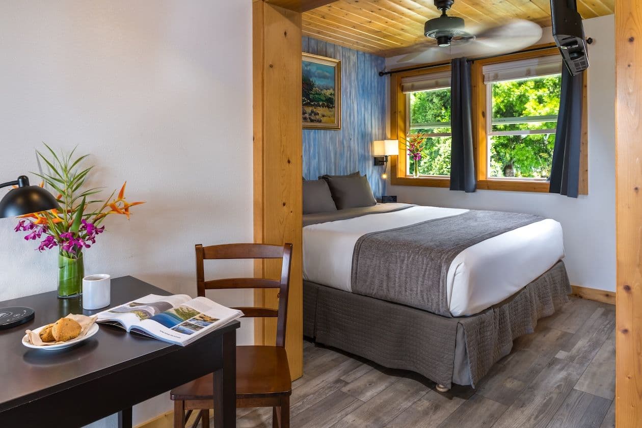 Hotel room with bed and desk at Kamuela Inn in Waimea on Big Island Hawaii.