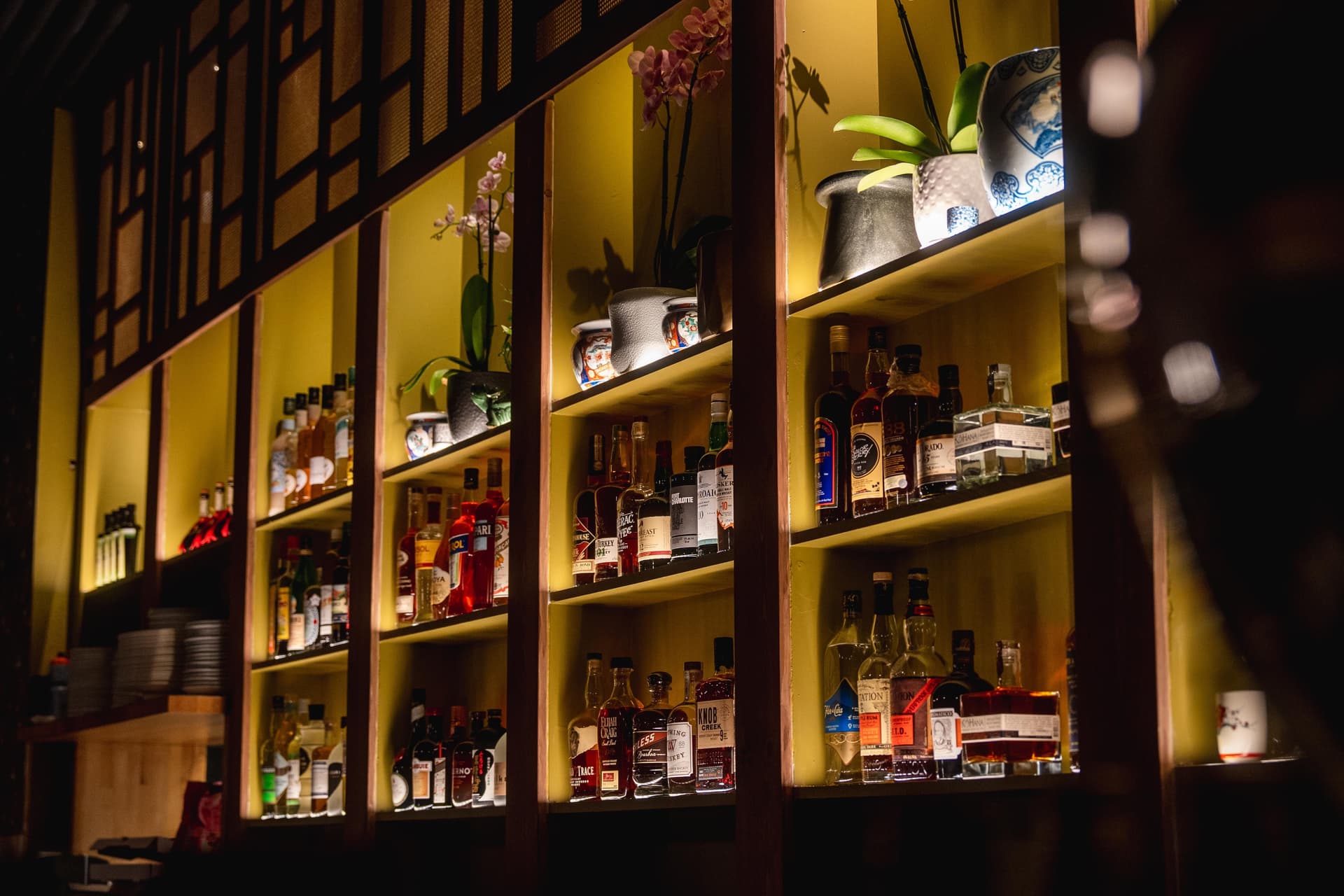back bar with shelves of liquor
