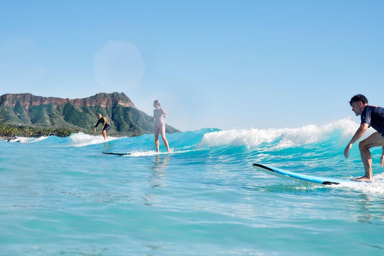 surfing waikiki in front of diamond head crater