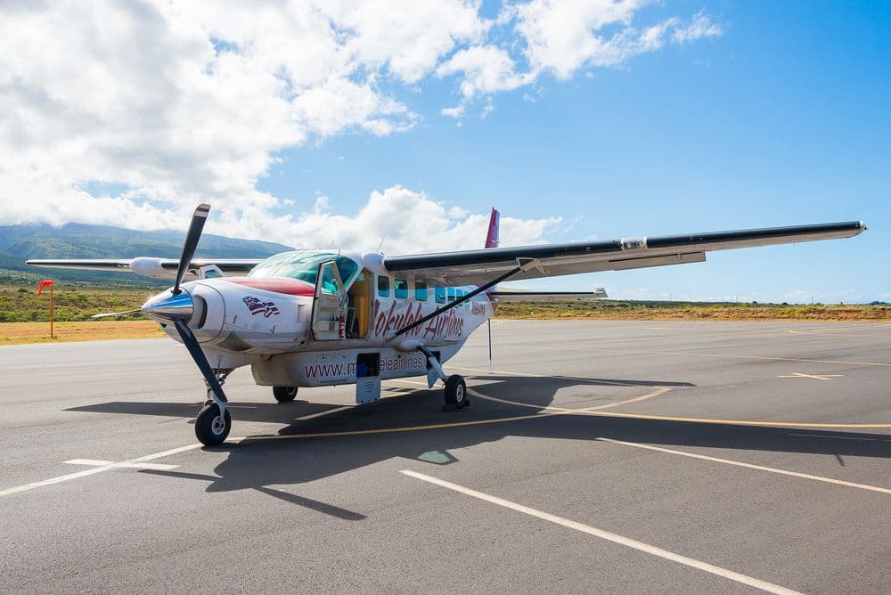 A prop propeller airplane on a runway in Maui, Hawaii.