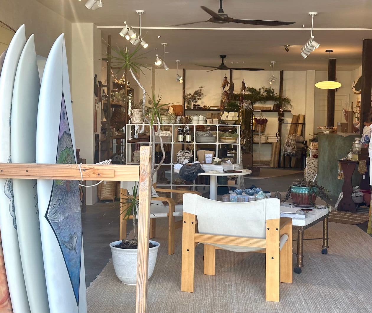 Retail shop with surfboards and gifts.