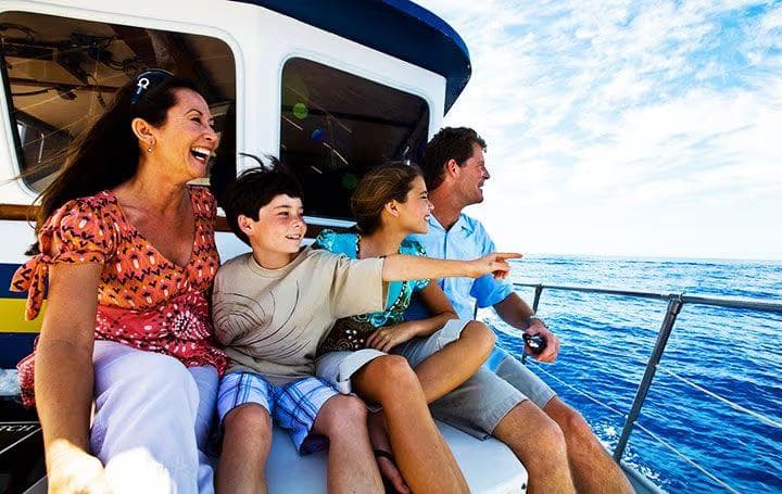A family on a boat in Hawaii.