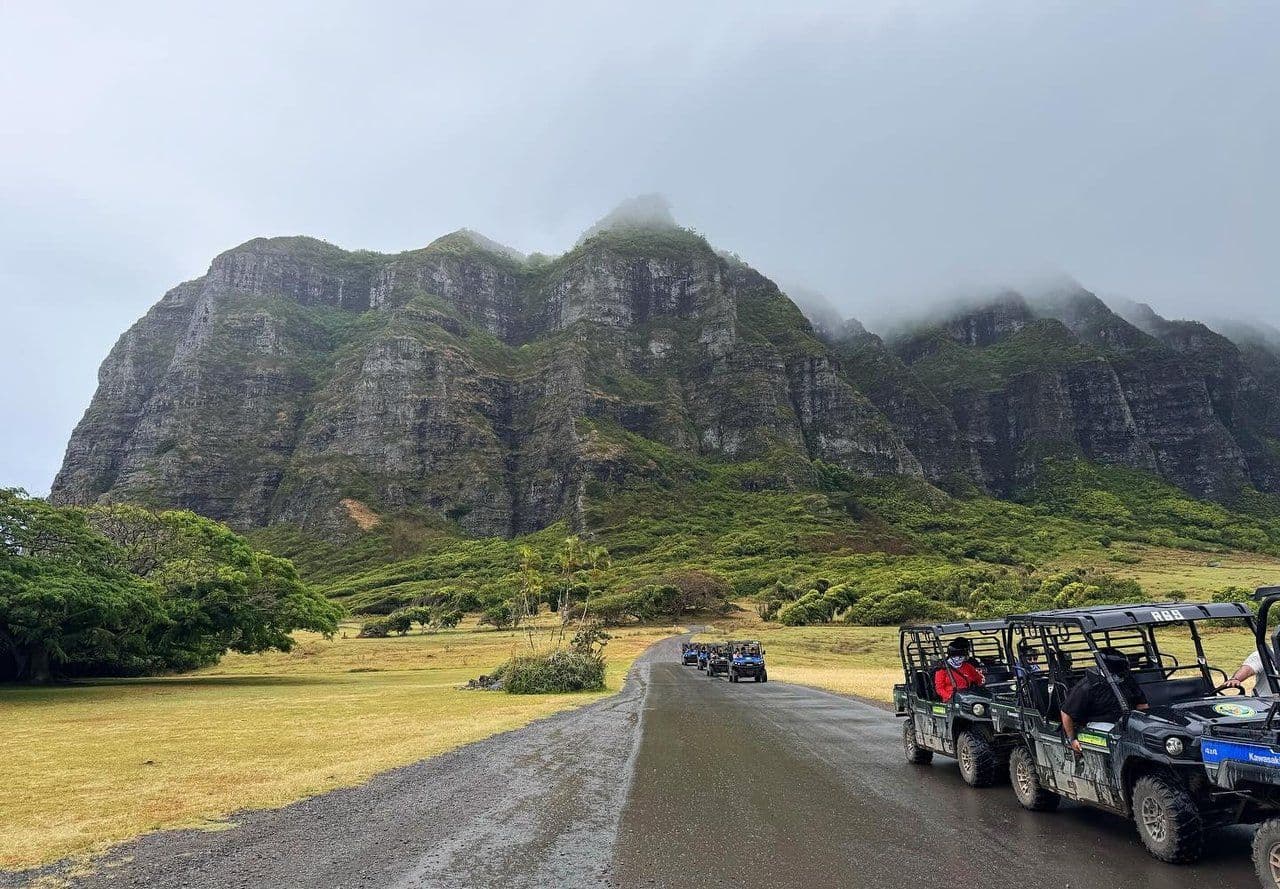 ATVs in front of large mountain