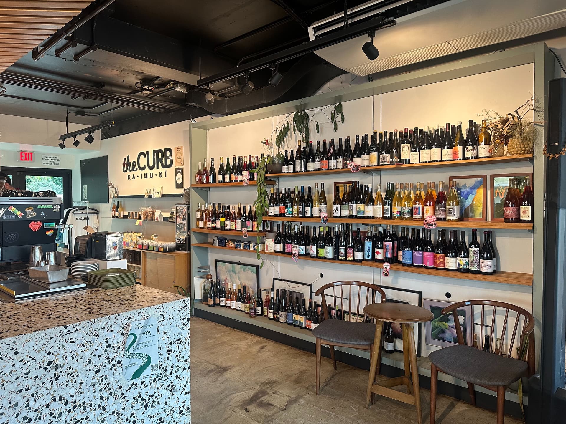 shelves of wine inside coffee shop