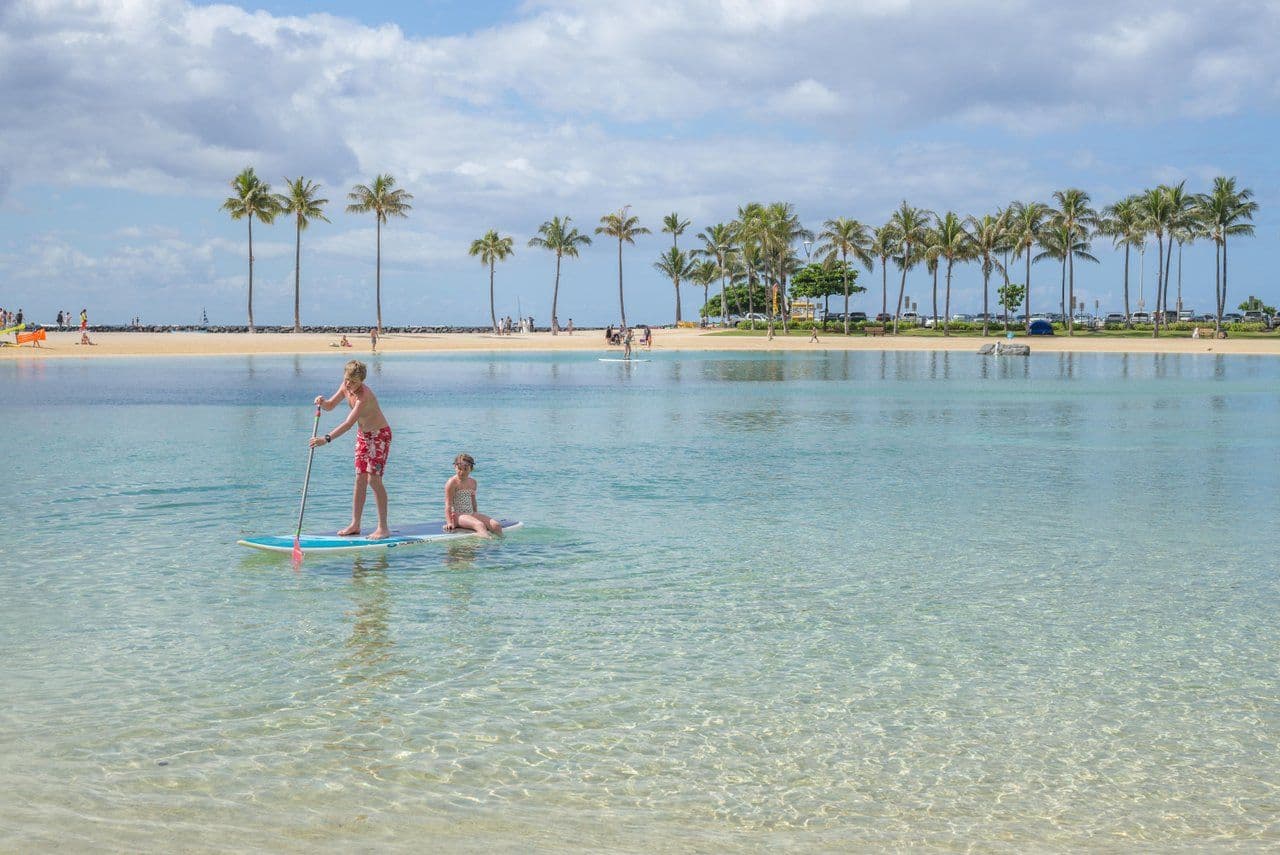 kids on SUP in ocean