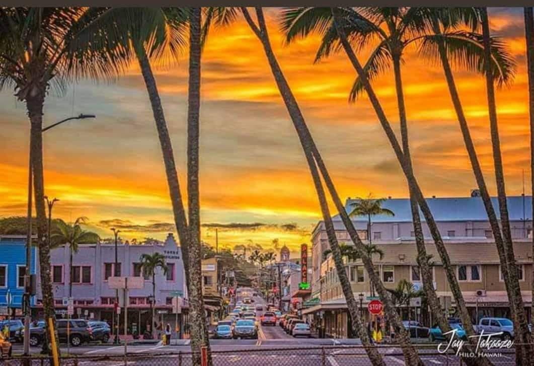 Sunset over historic downtown Hilo. (Photo Credit: Jay Takaaze)