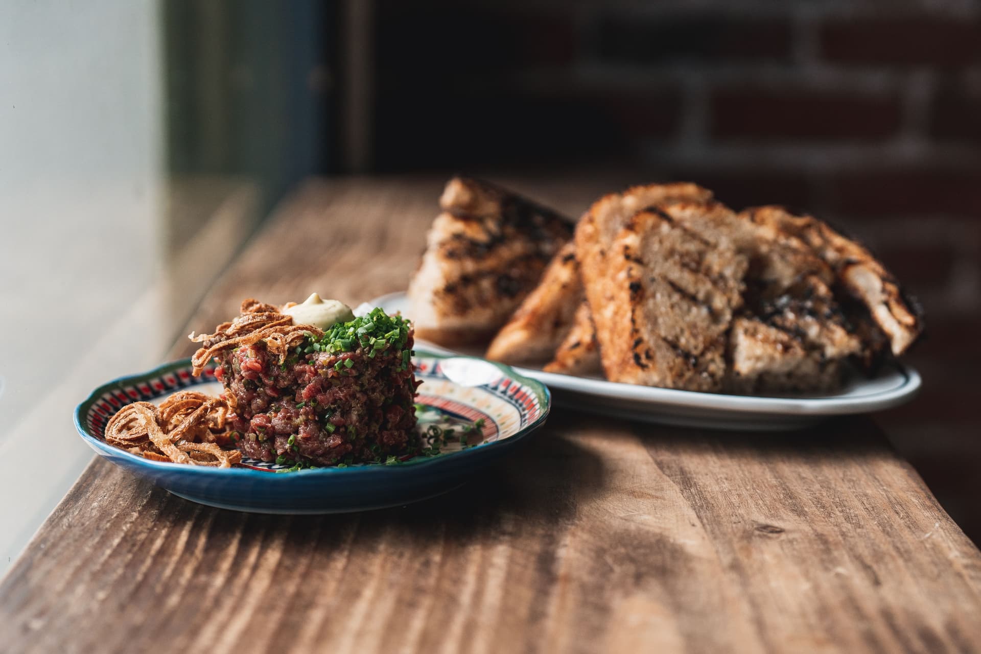 steak tartare and sliced bread.