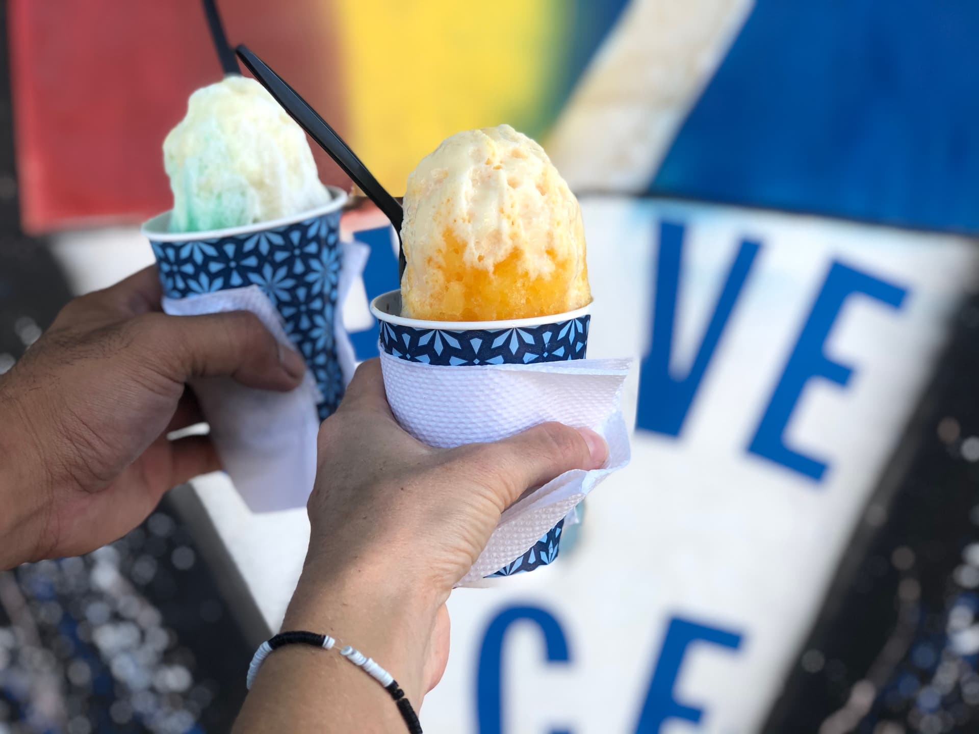 two hands holding shave ice