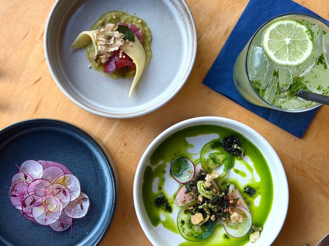 A birdseye view of three seafood dishes at Spoon & Key Market on Maui Hawaii.