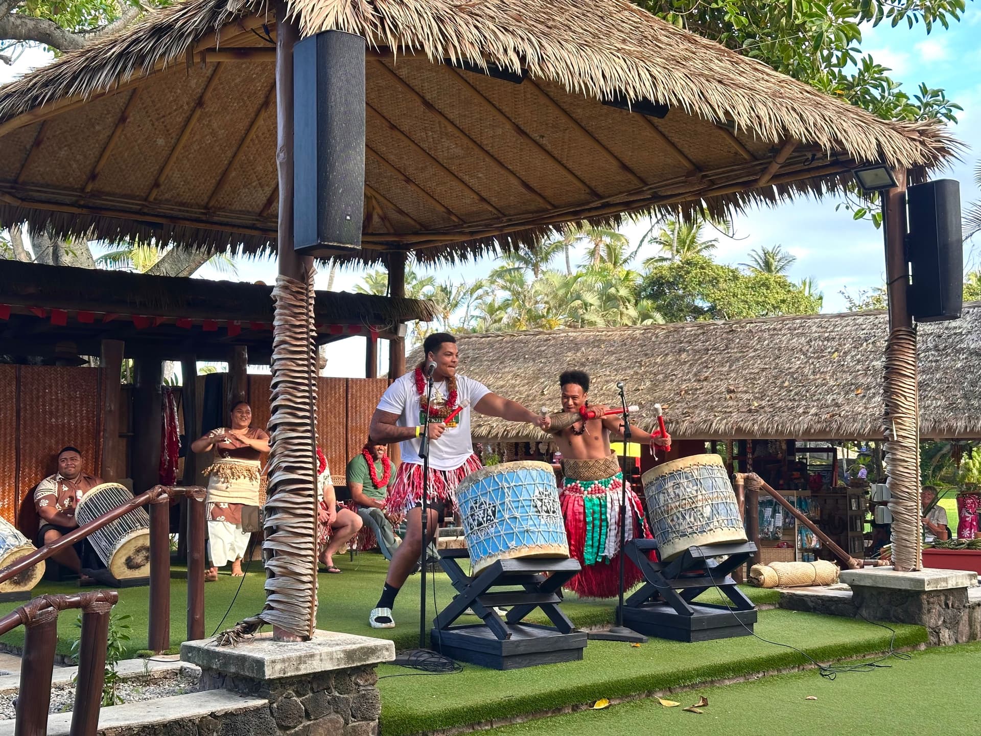 Men on stage playing tongan drums