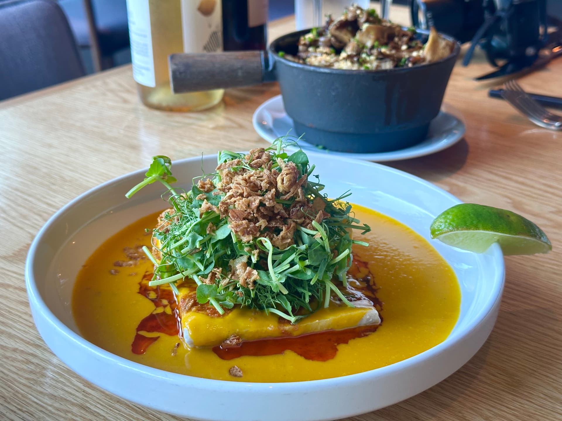 fish in an orange curry sauce