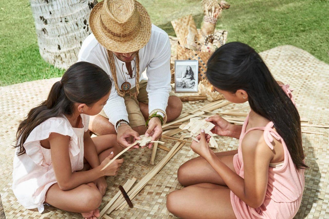 Kids weaving at a festival in Hawaii