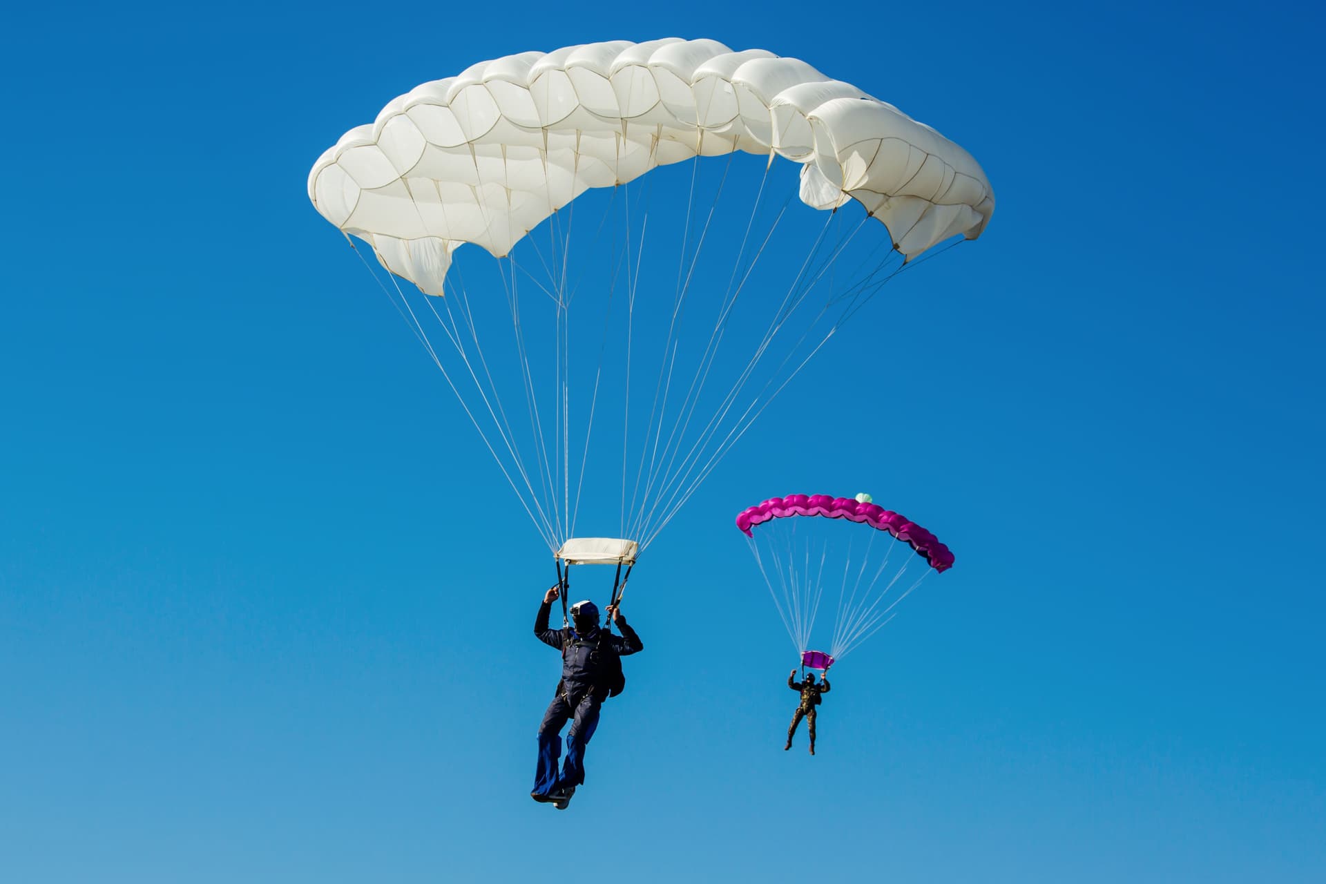 skydiving with a parachute in the sky