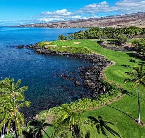 Aerial view of golf course by the ocean