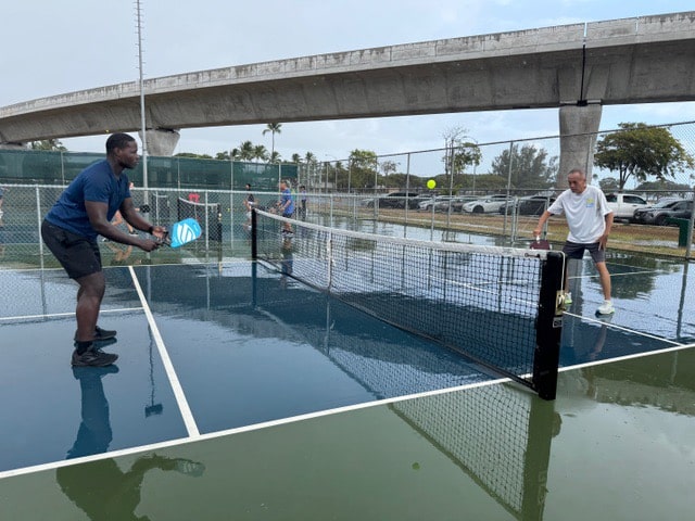 2 players play pickleball in Hawaii